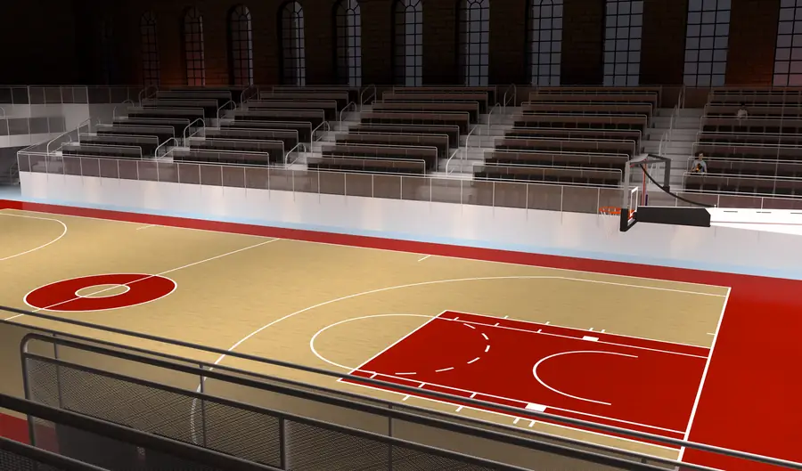 Bancadas e piso de um pequeno pavilhão desportivo, vistos do topo da bancada
